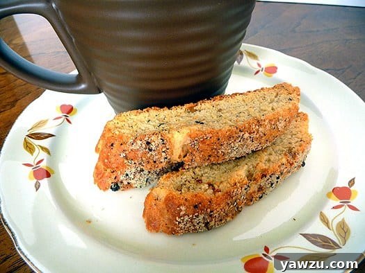 Parmesan black pepper biscotti on a white plate, ready to be enjoyed.