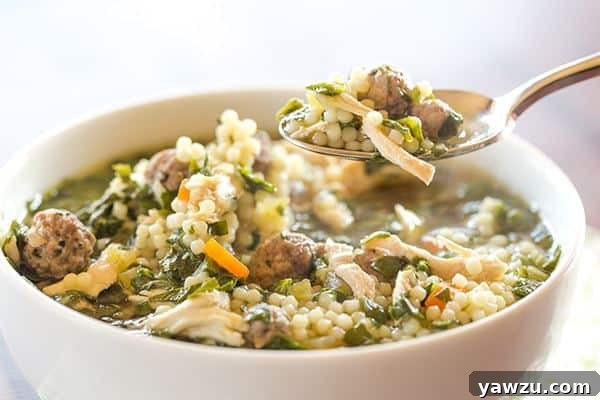Serving of Italian wedding soup in a white bowl