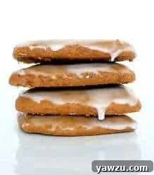 Stack of 4 Lebkuchen cookies on a white plate.