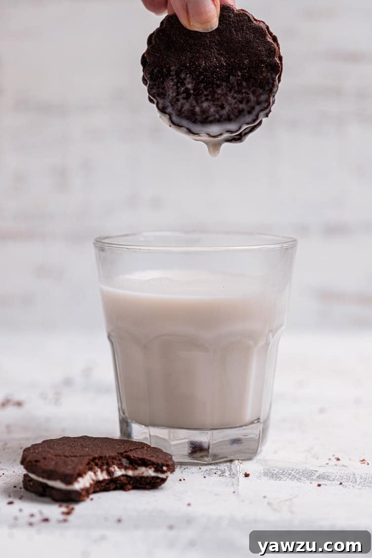 Dipping a homemade Oreo into a glass of milk.