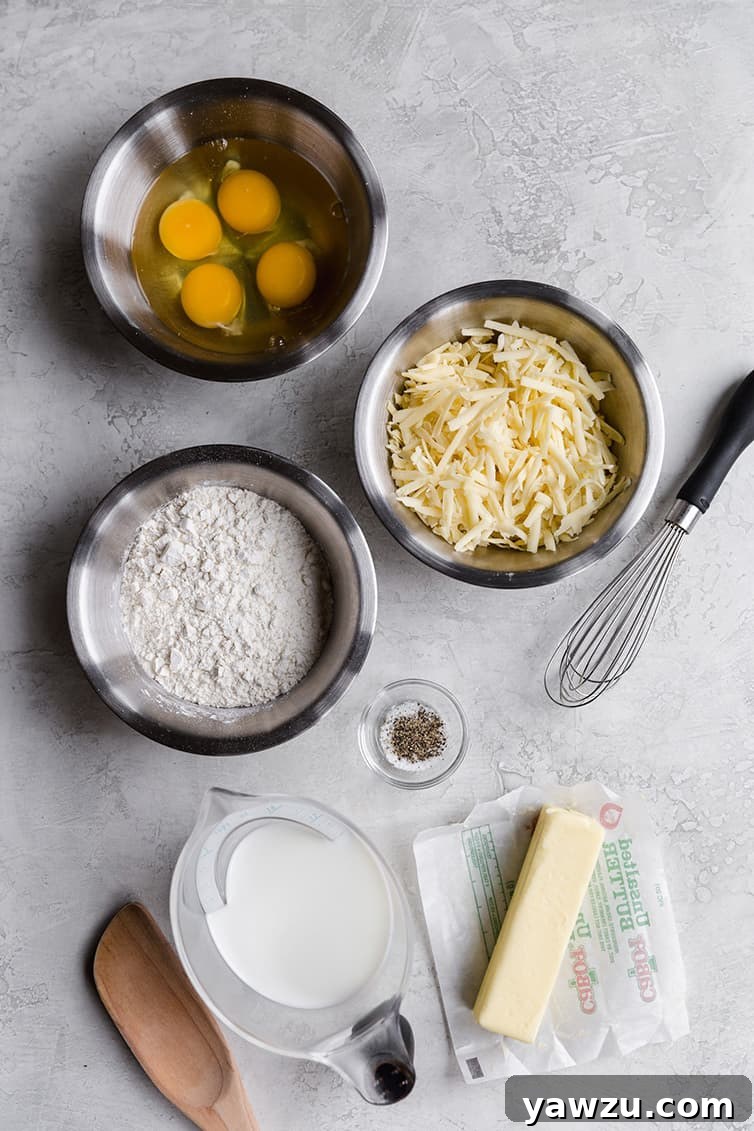 All the raw ingredients for Gougères laid out on a clean surface, ready for preparation.