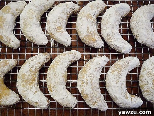 Delicious Nut Crescent Cookies cooling on a wire rack, ready for a dusting of powdered sugar.
