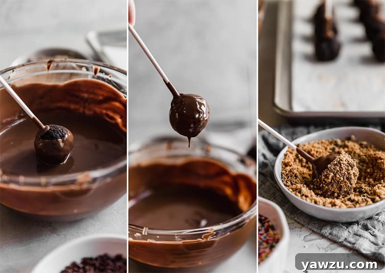 A chocolate cake pop being dipped into melted chocolate coating, then rolled in crushed cookies for decoration.
