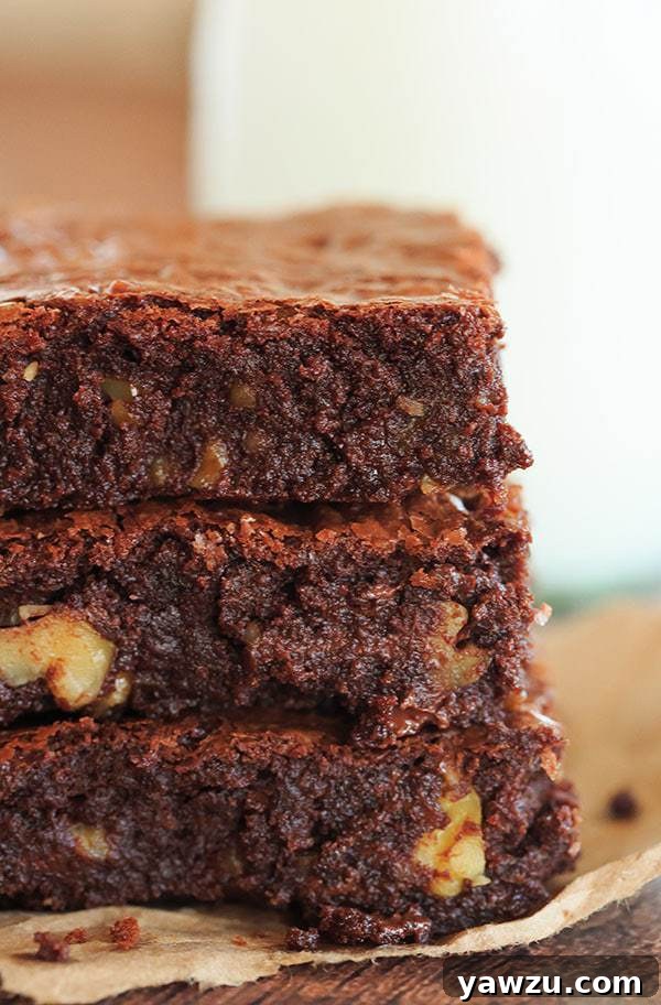 Closeup of a freshly baked Ina Garten Outrageous Brownie slice with walnuts