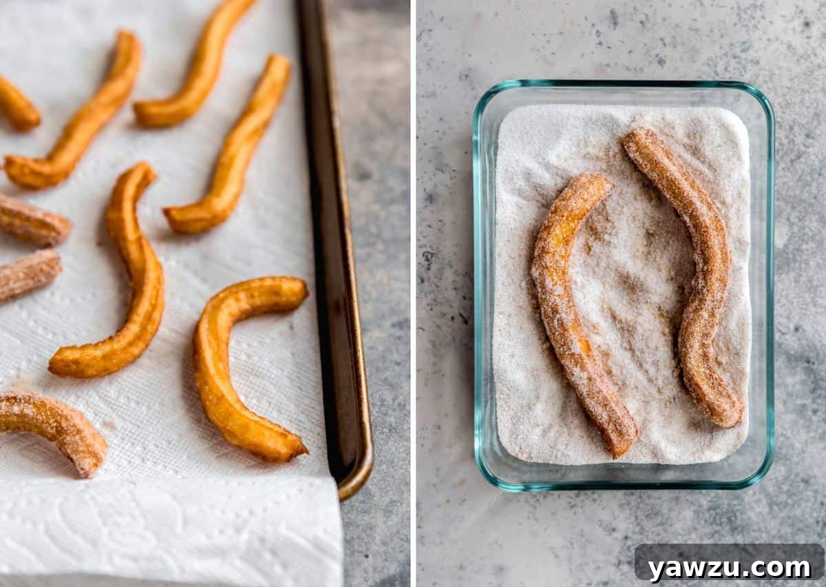 Fried churros on a paper-towel lined baking sheet on the left and a shallow glass container with cinnamon sugar coated churros on the right.