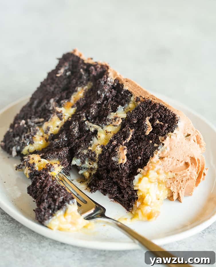 A delightful slice of German chocolate cake with a forkful bite taken out, inviting you to taste its rich layers.