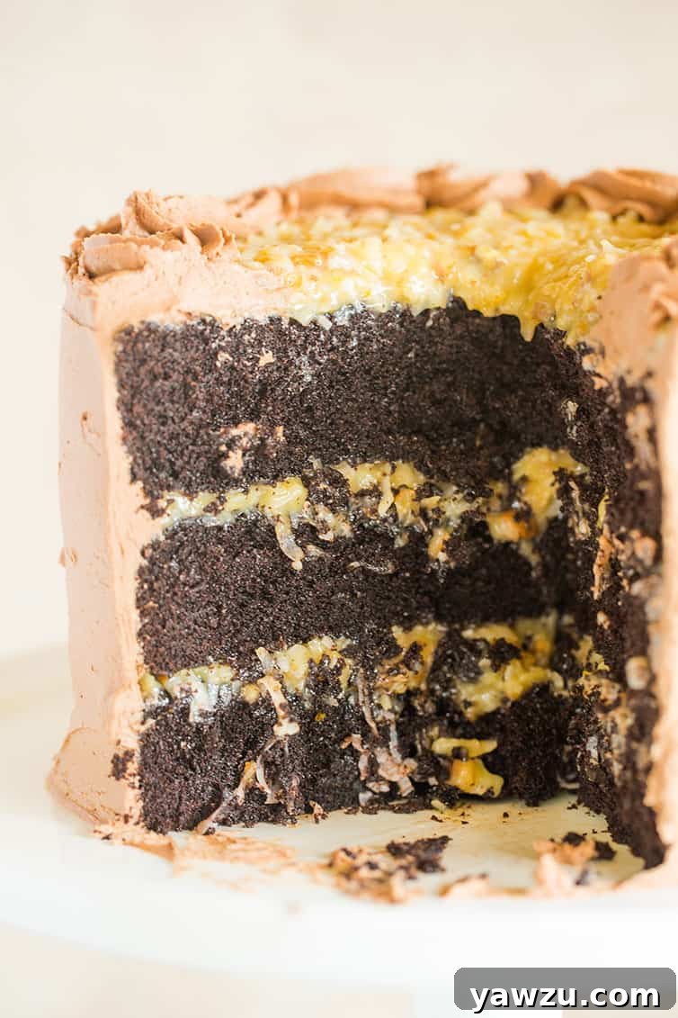 A glorious German chocolate cake with several slices already removed, revealing its mouth-watering interior layers.