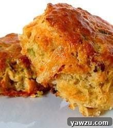 2 quiche lorraine scones on a white plate.