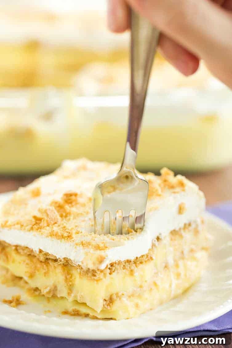 A piece of icebox cake with a fork digging right in!