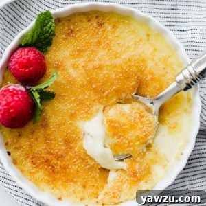 A top-down view of a completed Crème Brûlée with a golden-brown crust.