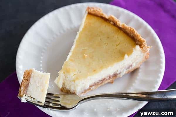 Hidden Berry Cream Cheese Torte - A luscious cream cheese filling sits atop a shortbread crust and a layer of strawberry jam. Discover this unique recipe at browneyedbaker.com