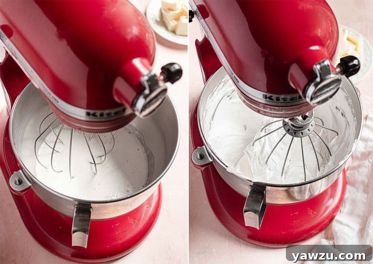 Meringue being whipped in a red stand mixer.