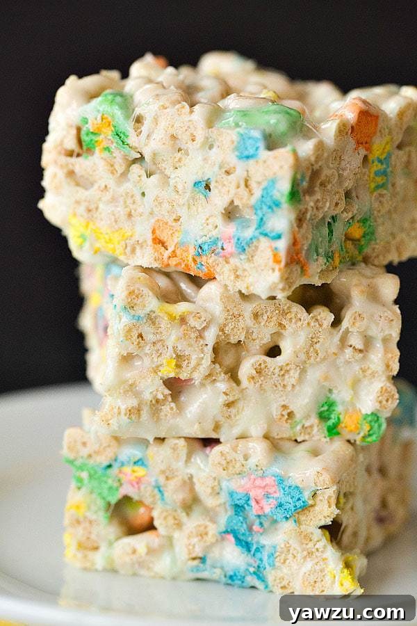 Close-up of vibrant Lucky Charms Marshmallow Cereal Treats, showcasing the colorful marshmallows and crisp cereal, perfect for St. Patrick's Day fun.