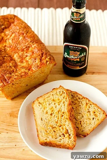 A rustic loaf of Irish Beer and Cheese Bread, with a golden crust and a hint of a cheesy interior, perfect for a savory St. Patrick's Day accompaniment.