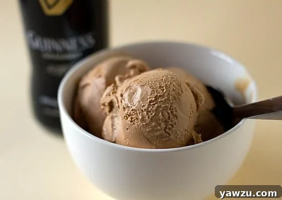A scoop of rich Guinness-Milk Chocolate Ice Cream in a bowl, showcasing its creamy texture and inviting dark color, perfect for a unique St. Patrick's Day dessert.