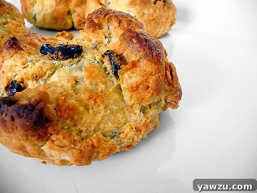 Delicious Irish soda bread scones, perfectly golden brown on a white plate, ready to be enjoyed.