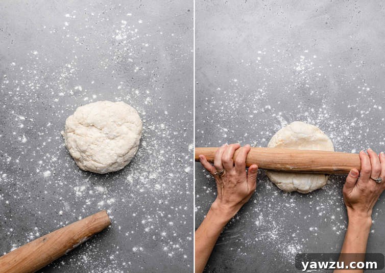 Ball of pie dough on counter being rolled out.