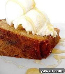 Slice of honey vanilla sour cream pound cake topped with vanilla ice cream and a drizzle of honey.
