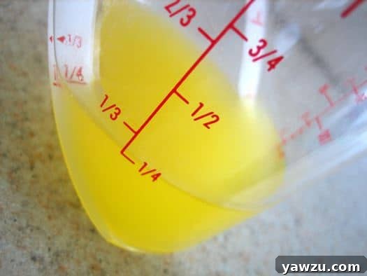 Melted butter in a glass measuring cup, ready for baking.