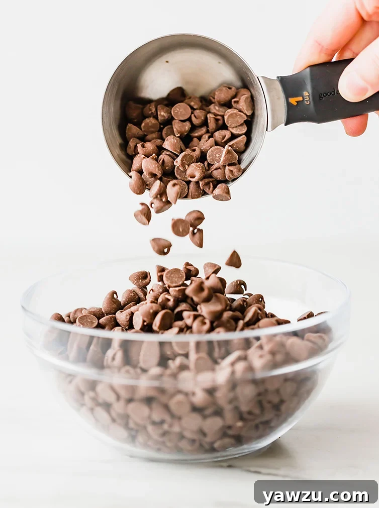 Smiling baker presenting a freshly baked treat, symbolizing joy and success in home baking.