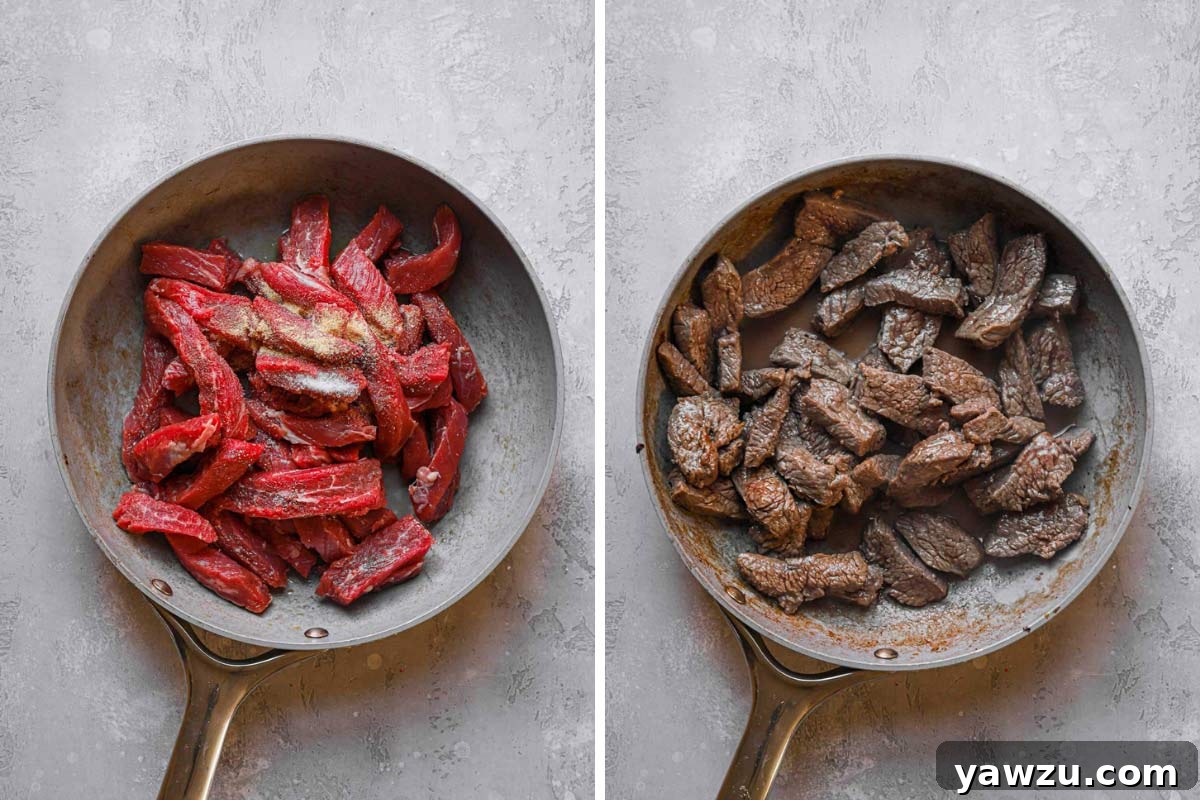 Thinly sliced flank steak being stir-fried in a hot skillet with seasonings, creating a delicious sear.