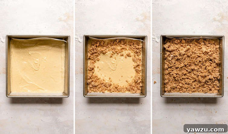 Crumb cake batter in cake pan covered with crumb topping.