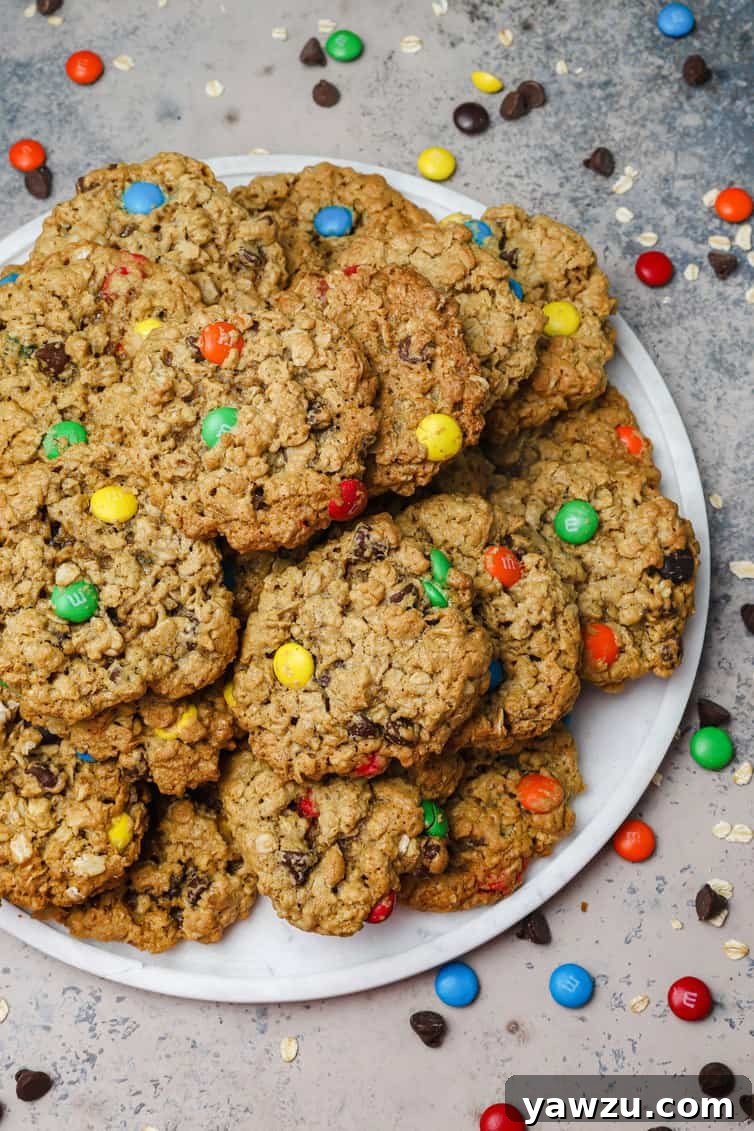 A white plate piled high with monster cookies.