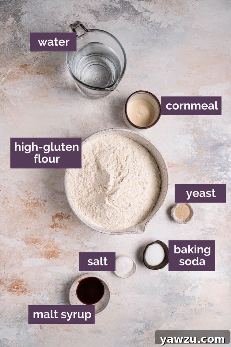 Ingredients for homemade bagels prepped and labeled on a kitchen counter.