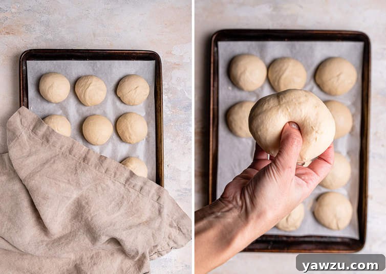 A hand pressing a thumb through the center of a ball of bagel dough to create the characteristic hole.