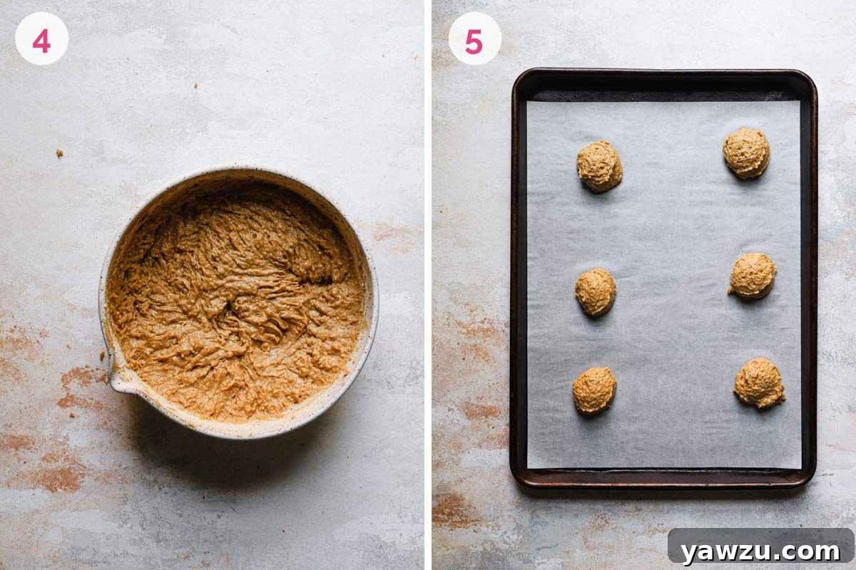 A bowl of graham whoopie pie batter sits beside a baking pan with scoops of dough neatly spaced before entering the oven.