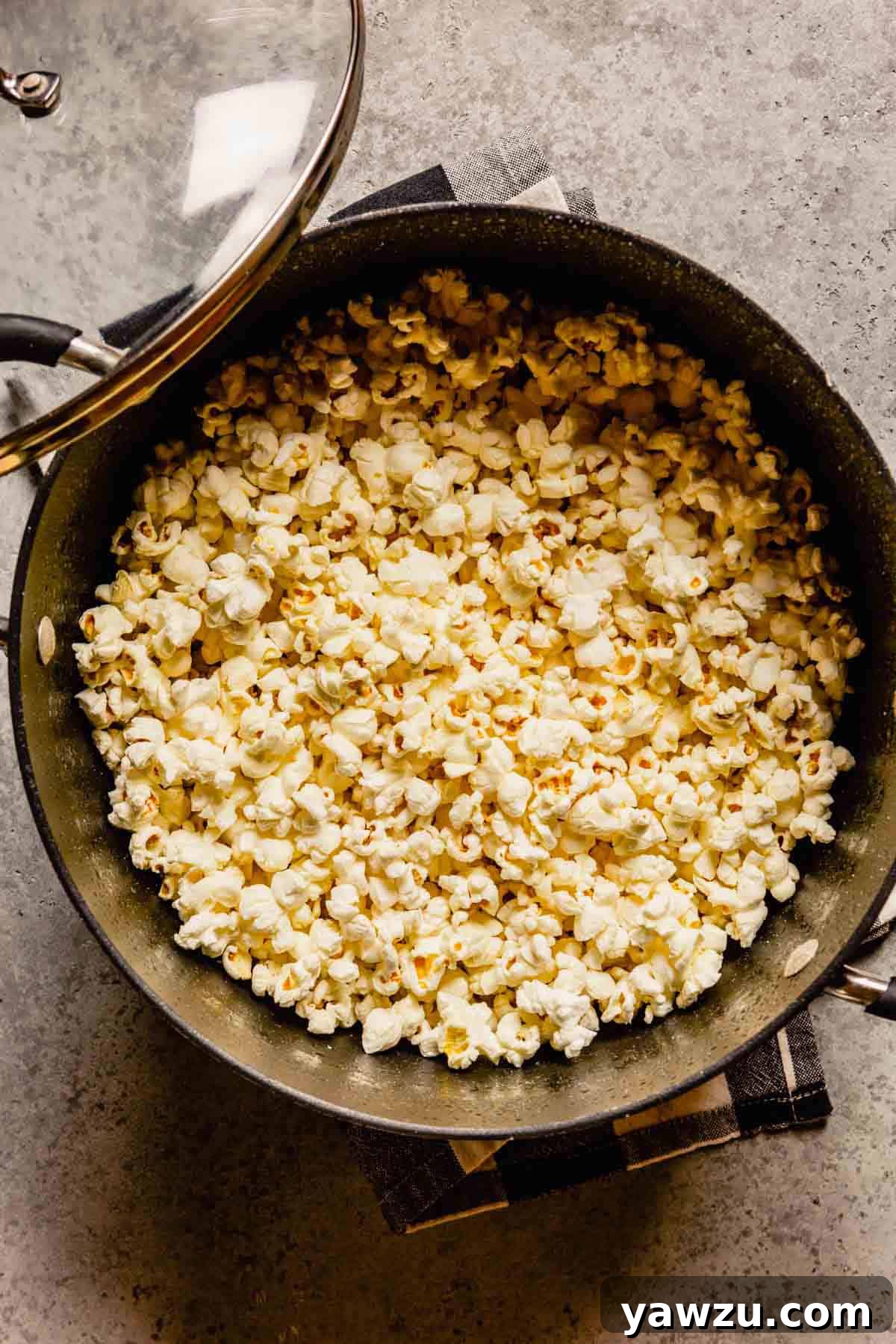 Pot full of popped popcorn.