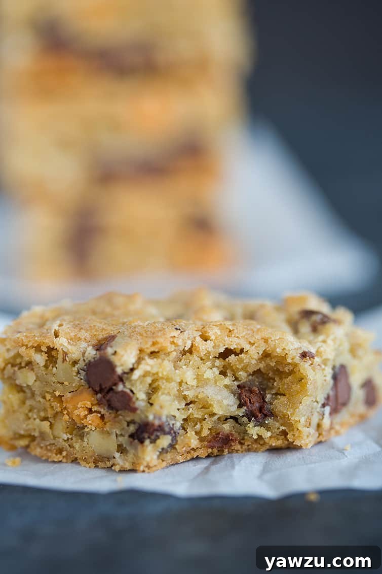 A fully-loaded chewy, chunky blondie with a big bite taken out!