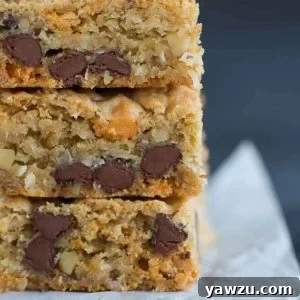 A big stack of chewy, chunky blondies with chocolate chips, butterscotch chips, walnuts and coconut.