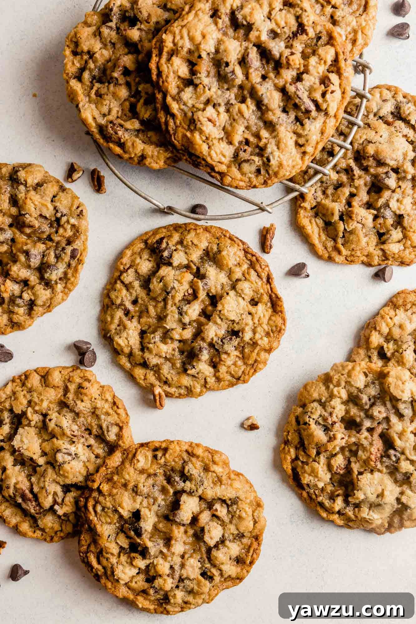 Overhead photo of cowboy cookies spread out on a counter.
