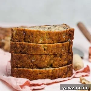 A freshly baked loaf of Grandma's Banana Nut Bread, golden brown and inviting.