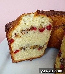 Side view of Russian pound cake with a slice removed showing the inside texture and layers.