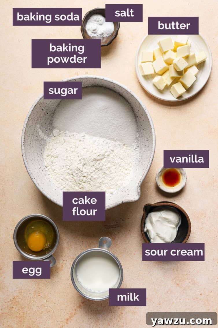 Ingredients for vanilla cupcakes on a counter labeled with purple labels.