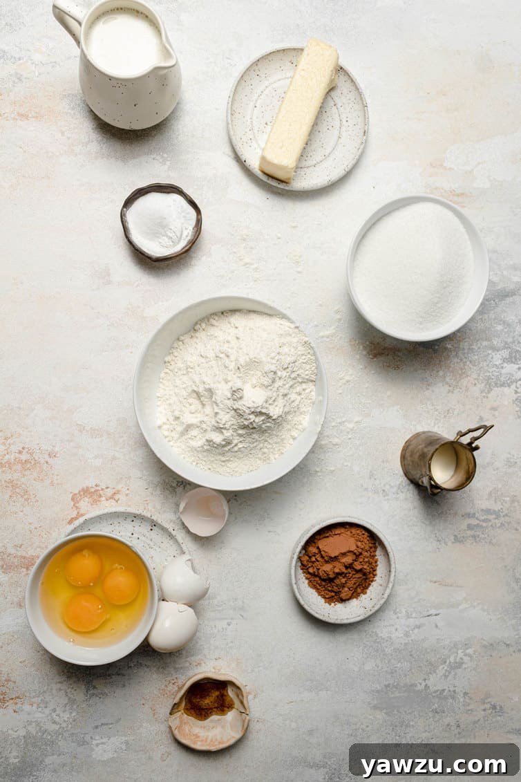 Ingredients for zebra cake prepped in bowls in counter.