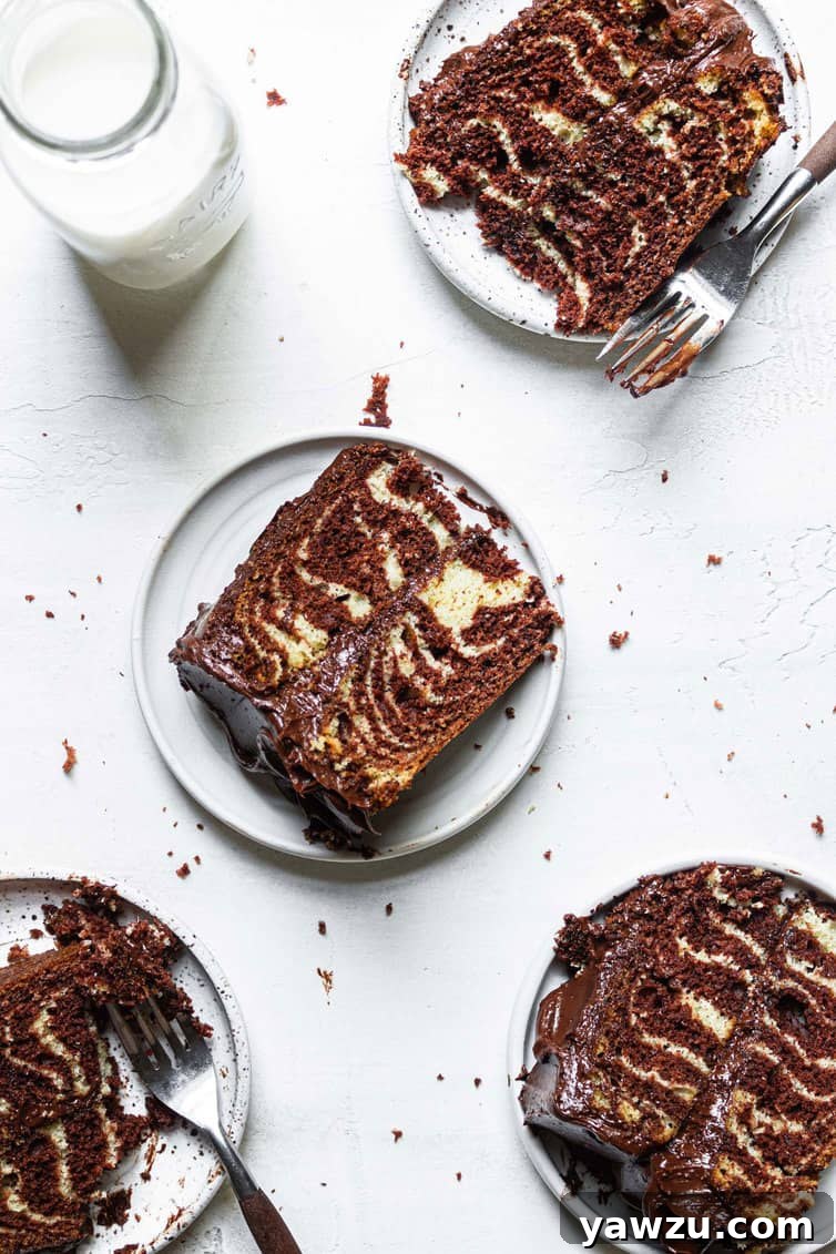 Individual slices of zebra cake on plates.