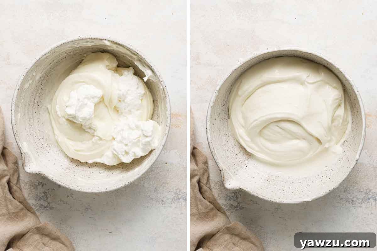 Cream cheese filling for strawberry pretzel salad mixed together in a mixing bowl.